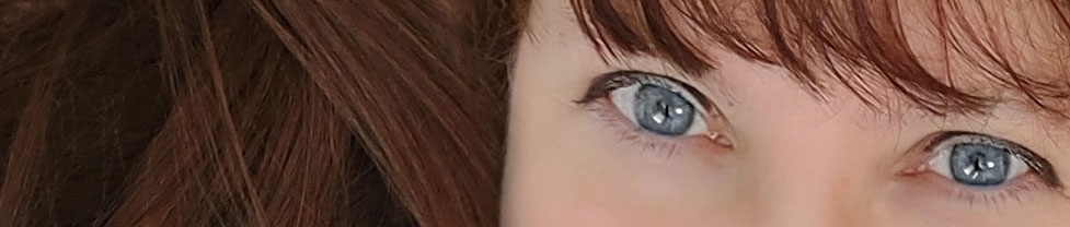 Big Breast DD Red Head Vegas Escort Close Up Picture Blue shirt and black and nude bra of Angelica: a top rated female Vegas escort.